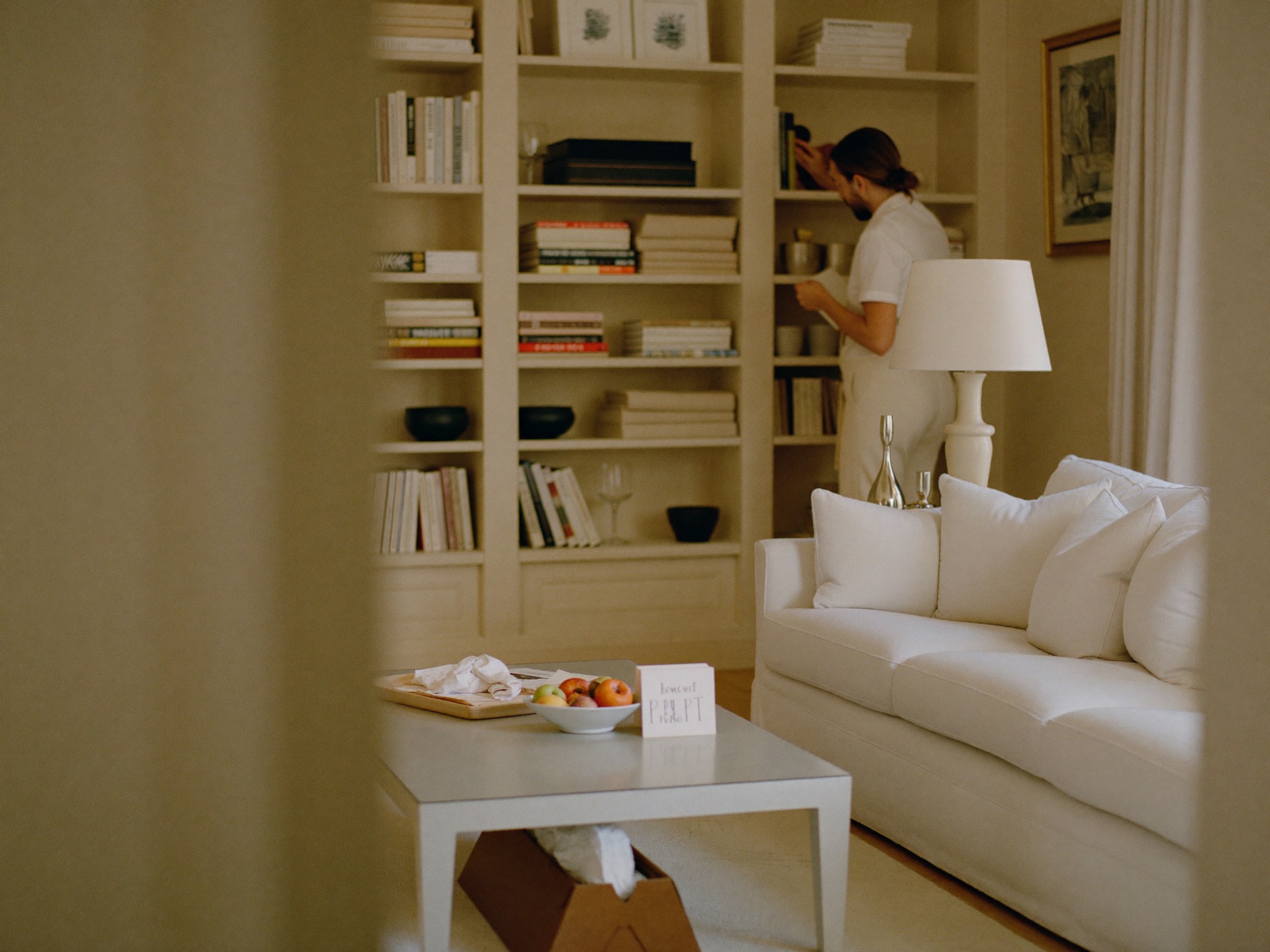 A pristine, guest-ready short-term rental living room in soft natural light.